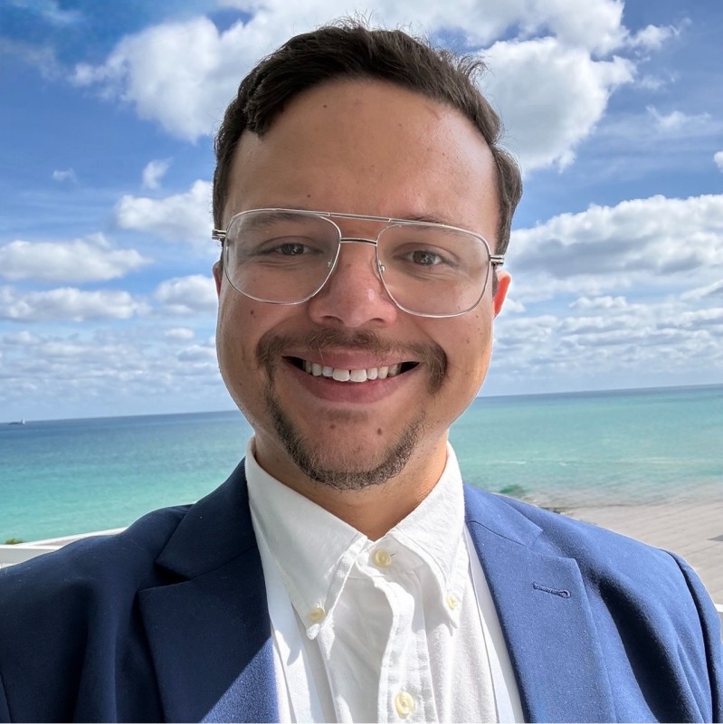 Professional headshot of Cris Santiago